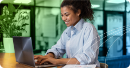 A woman typing at a computer